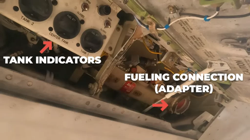 A 737 fuel panel with labeled parts. The tank indicators are on the left, showing how much fuel is in each tank. There is a adapter on the right for fuel hoses to connect to.